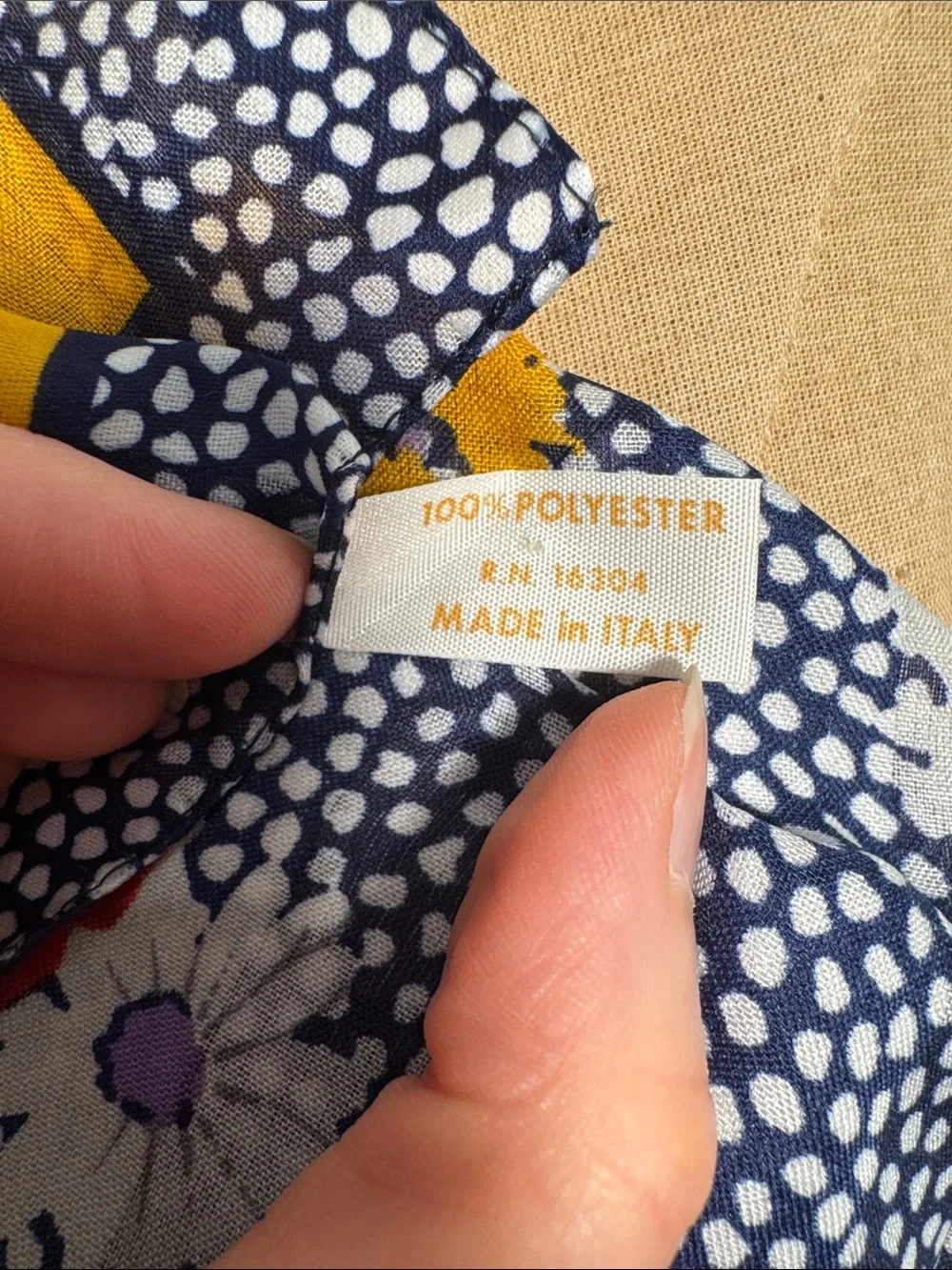 Navy, yellow, and red square poly floral scarf.